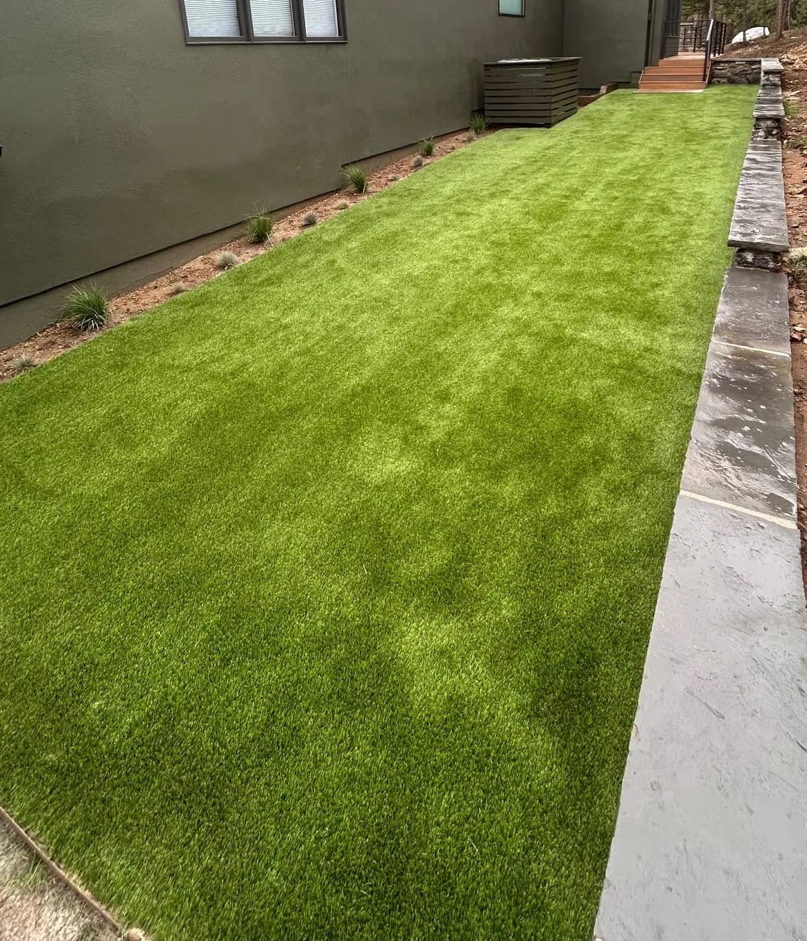 Gallery photos for Artificial Turf Dog Run at a Mountain Home That Stays Clean Year-Round: Image #1