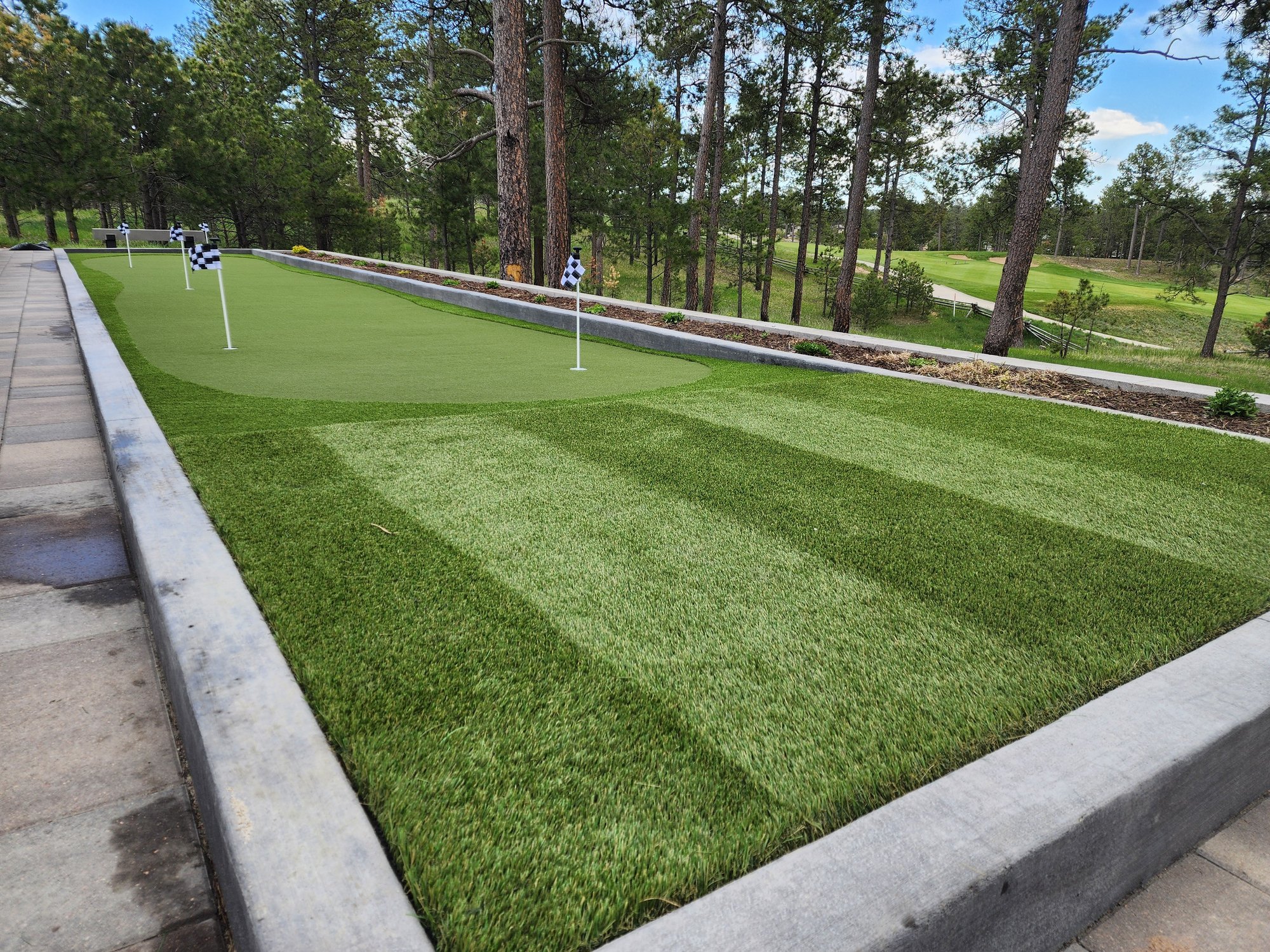 Putting green and chipping area in an underused Bocce Ball court