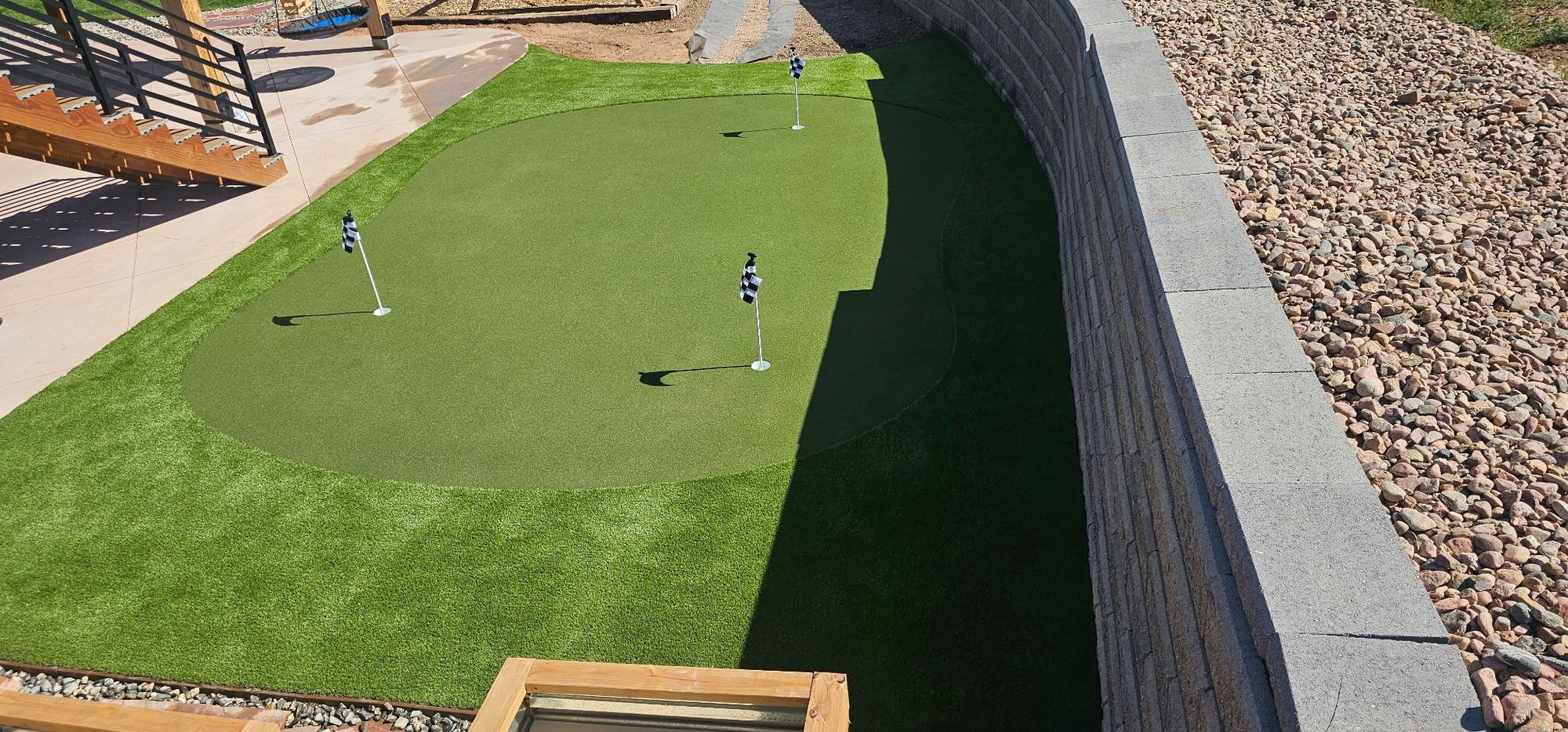 Putting green near patio area in Sedalia