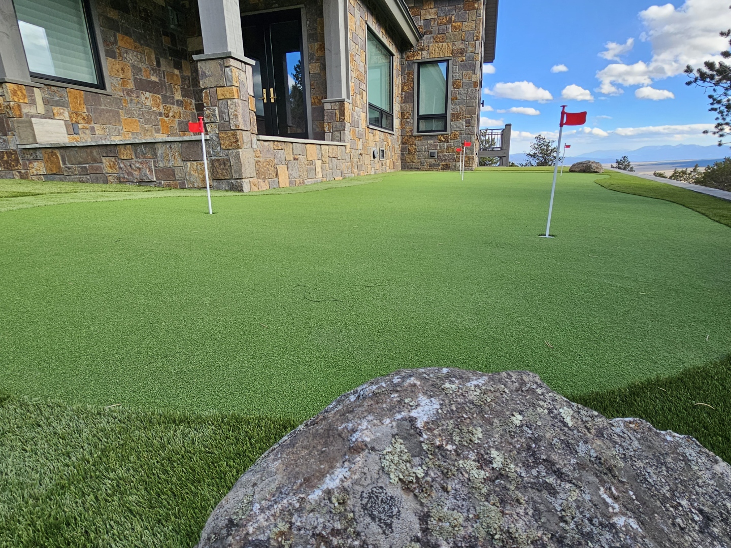 Putting green with boulder accents