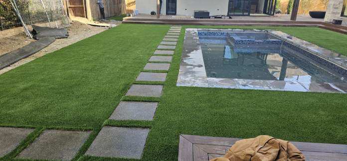 Pool area with concrete walkway